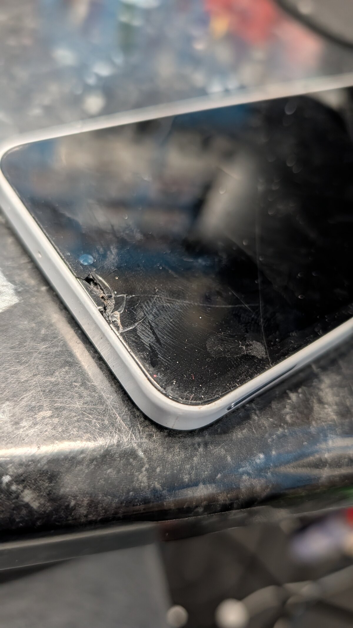 Samsung Galaxy A16 with a cracked, non-working screen after being dropped